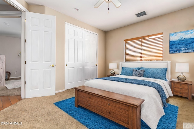 bedroom featuring a closet, visible vents, baseboards, and ceiling fan