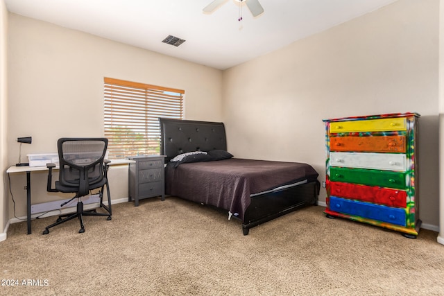 bedroom with light carpet and ceiling fan