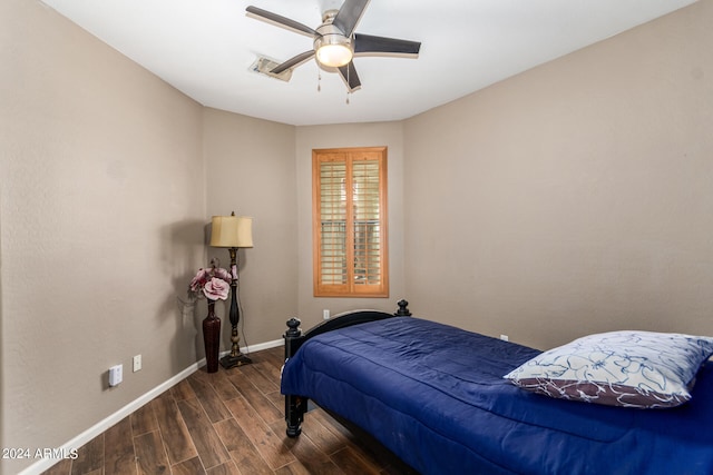 bedroom featuring ceiling fan and dark hardwood / wood-style floors