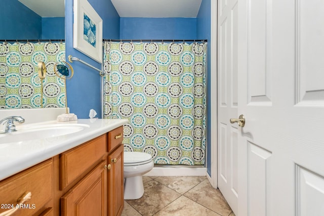 full bathroom with tile patterned floors, a shower with shower curtain, toilet, and vanity