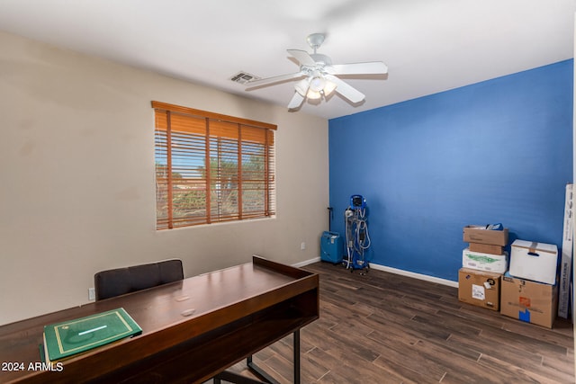 home office featuring dark wood-type flooring and ceiling fan