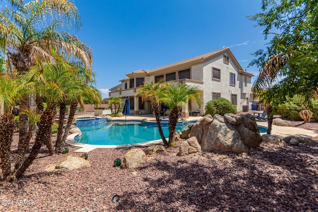 view of pool with a pool with connected hot tub and a patio area