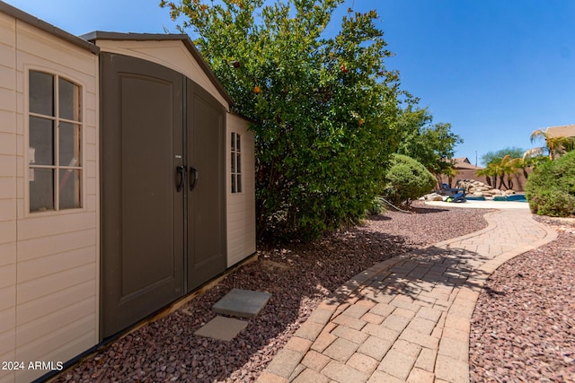 view of patio / terrace featuring an outbuilding