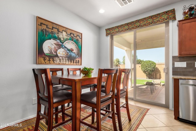 dining space with light tile patterned floors, baseboards, visible vents, and recessed lighting