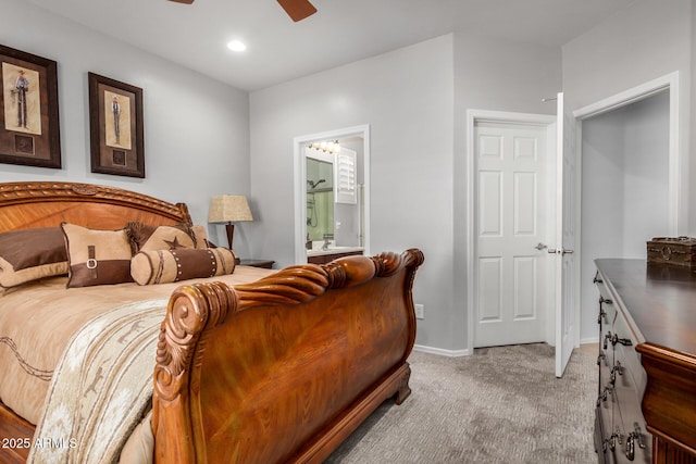 bedroom with ensuite bathroom, recessed lighting, light carpet, a ceiling fan, and baseboards