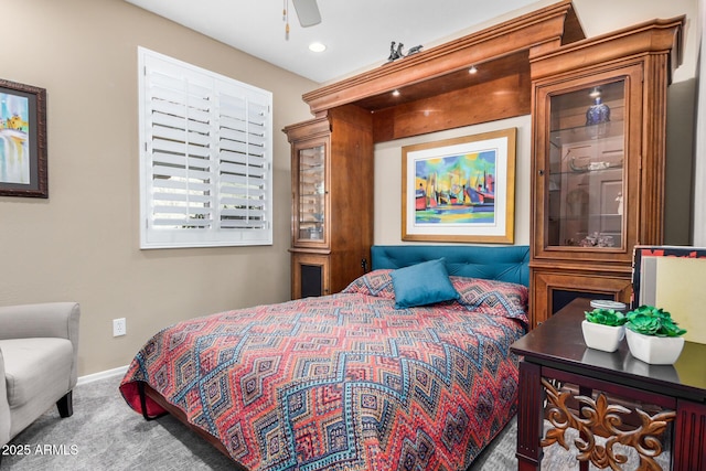 carpeted bedroom featuring baseboards