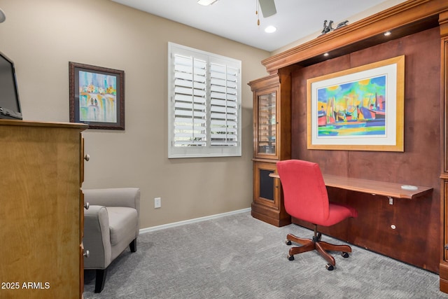 office area with carpet, ceiling fan, and baseboards