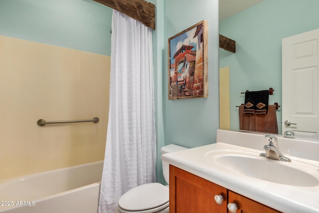 bathroom with shower / bath combo with shower curtain, vanity, and toilet