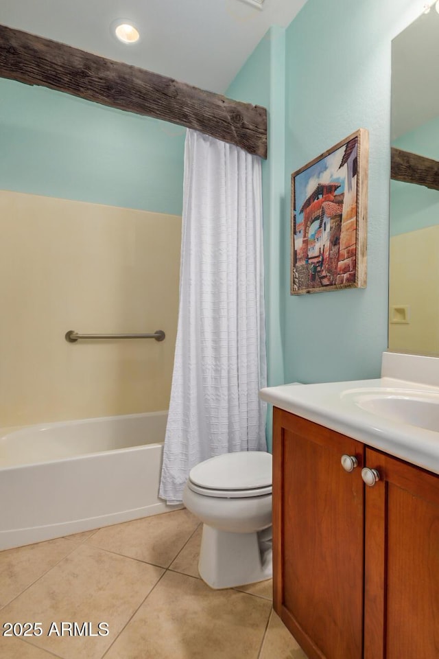 full bathroom featuring vanity, shower / bath combination with curtain, toilet, and tile patterned floors