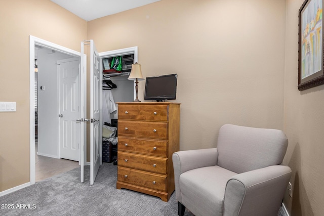 sitting room with carpet floors and baseboards