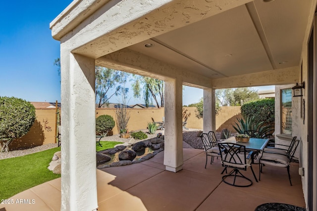 view of patio / terrace with outdoor dining area and a fenced backyard