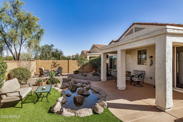 view of patio / terrace featuring fence