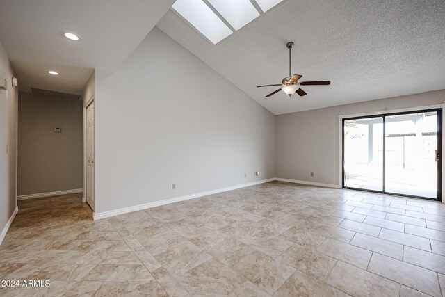 spare room with a textured ceiling, ceiling fan, and carpet floors