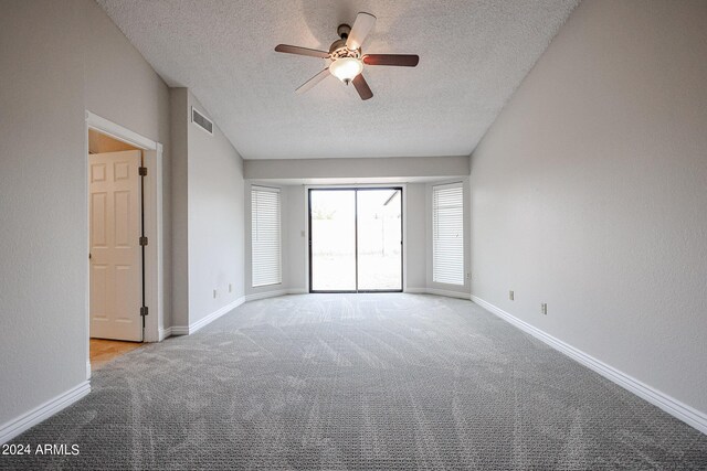 spacious closet with dark colored carpet