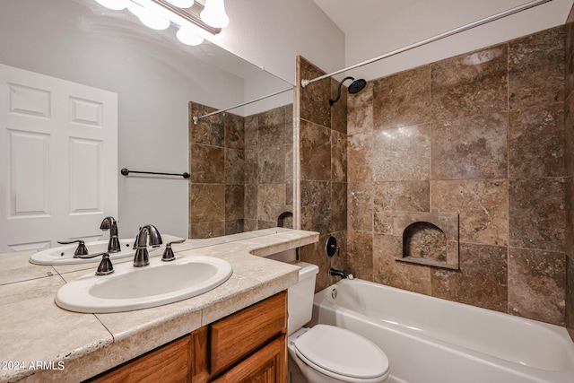 bathroom with bathtub / shower combination, vanity, and toilet