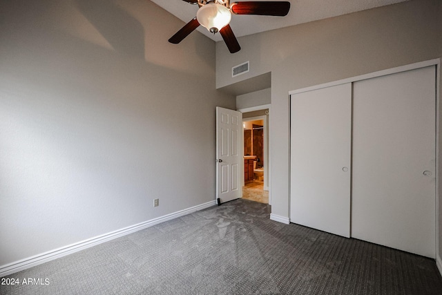 unfurnished bedroom with baseboards, visible vents, a ceiling fan, carpet floors, and a closet