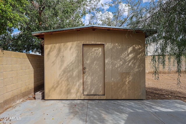 view of shed featuring a fenced backyard