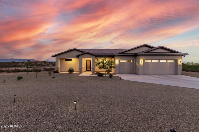 22050 W El Grande Trl, Wickenburg, AZ 85390 - ranch-style house featuring a garage, stucco siding, and concrete driveway