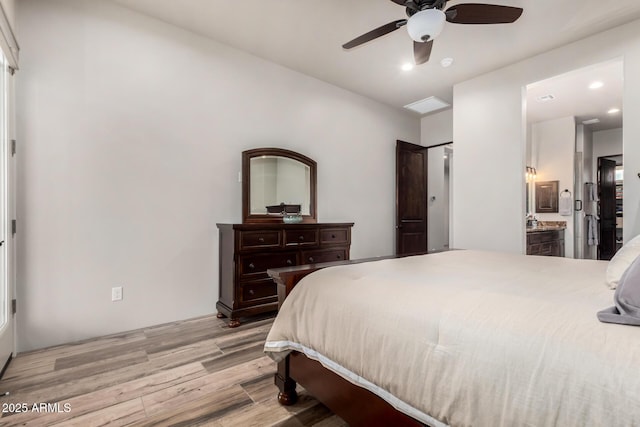 22050 W El Grande Trl, Wickenburg, AZ 85390 - bedroom featuring ensuite bathroom, recessed lighting, light wood-style floors, and a ceiling fan