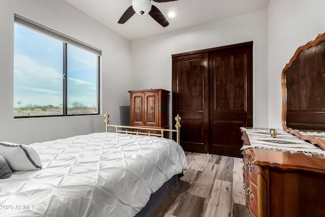 22050 W El Grande Trl, Wickenburg, AZ 85390 - bedroom featuring light wood-style flooring and a ceiling fan