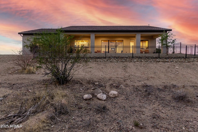 22050 W El Grande Trl, Wickenburg, AZ 85390 - rear view of house featuring fence and stucco siding