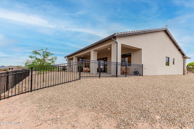 22050 W El Grande Trl, Wickenburg, AZ 85390 - rear view of property with a patio, stucco siding, and fence