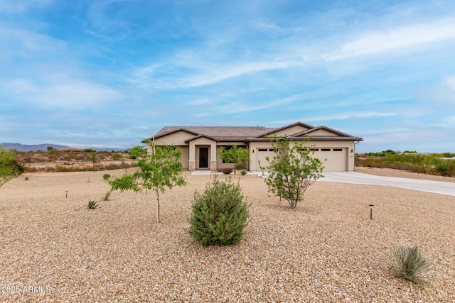 22050 W El Grande Trl, Wickenburg, AZ 85390 - single story home with concrete driveway, stucco siding, and a garage