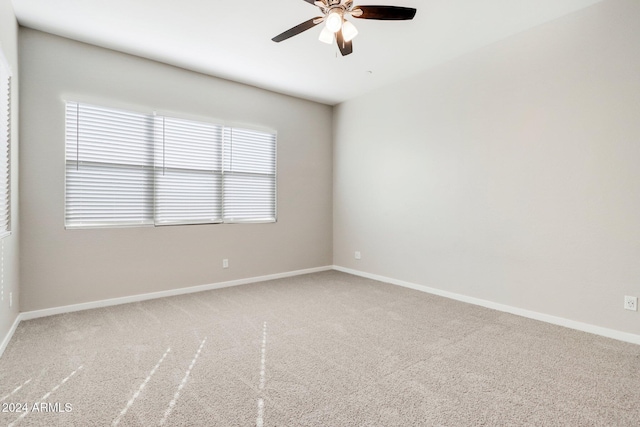 empty room with carpet flooring and ceiling fan