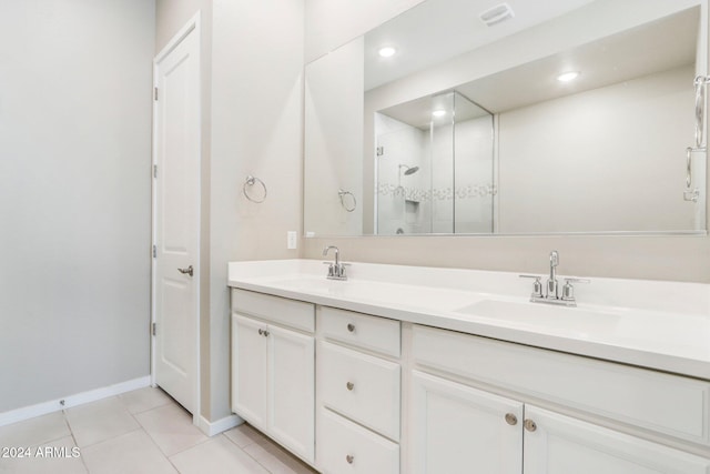 bathroom featuring vanity, tile patterned floors, and an enclosed shower