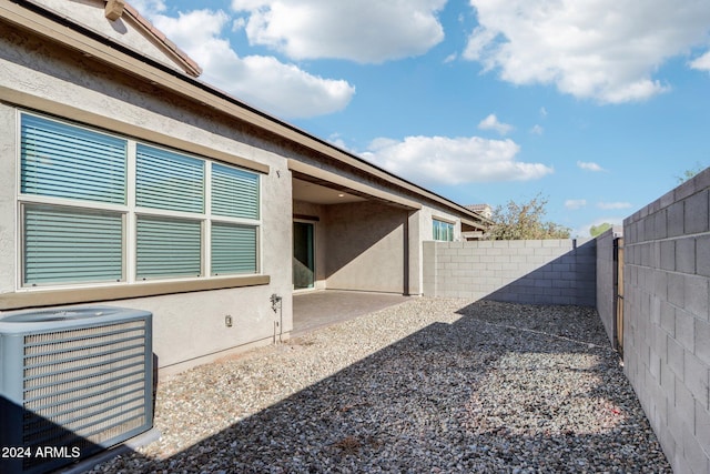 view of yard with a patio area and central air condition unit