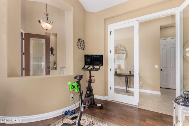 exercise area featuring hardwood / wood-style floors