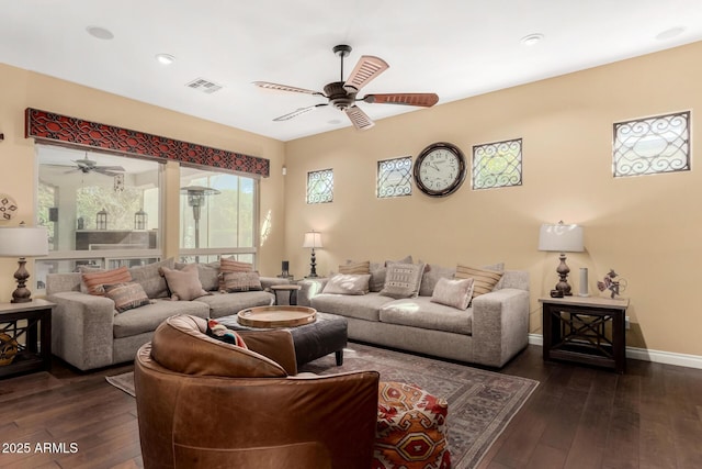 living room featuring ceiling fan and dark hardwood / wood-style flooring