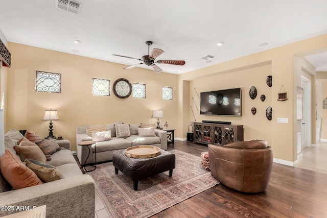 living room featuring hardwood / wood-style flooring and ceiling fan