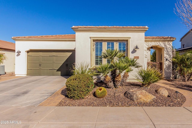 mediterranean / spanish-style house featuring a garage