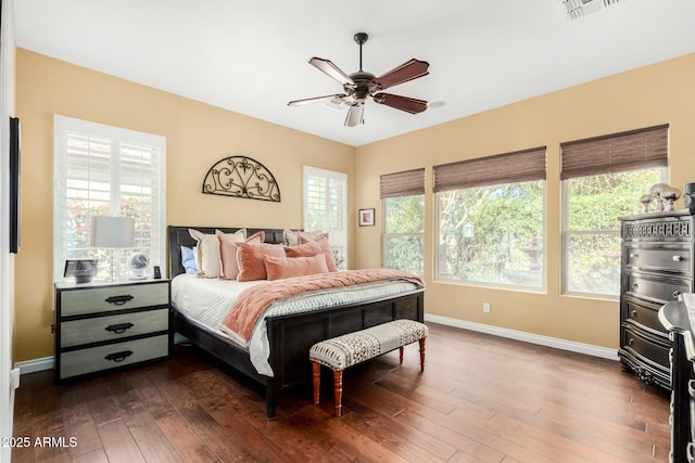 bedroom with dark wood-type flooring and ceiling fan