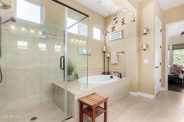 bathroom featuring separate shower and tub, a healthy amount of sunlight, and tile patterned floors