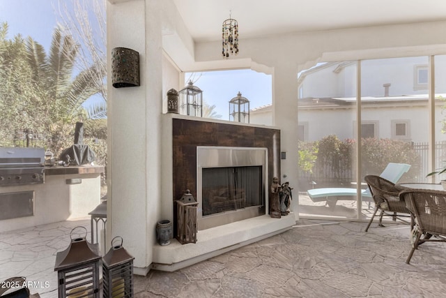 living room featuring a tiled fireplace