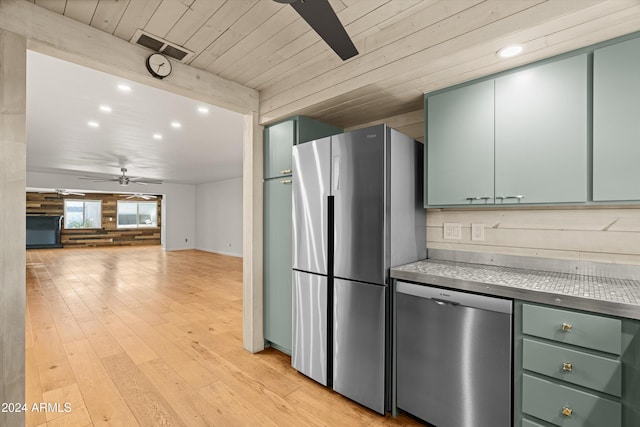 kitchen featuring appliances with stainless steel finishes, light hardwood / wood-style flooring, ceiling fan, and wood ceiling