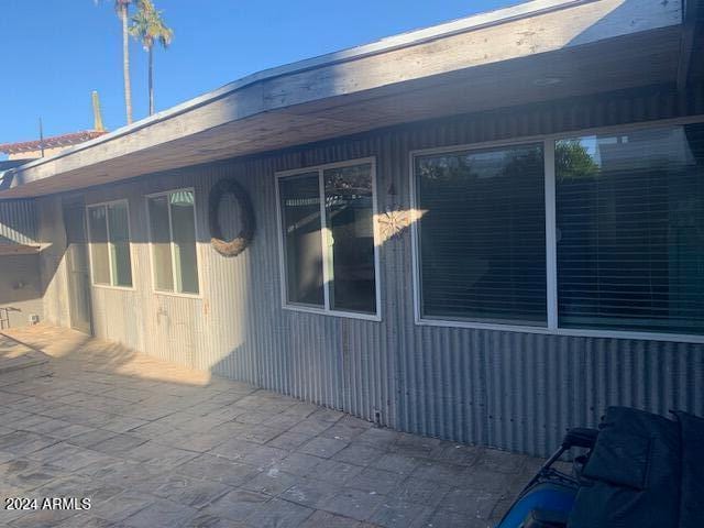 view of side of property with a patio