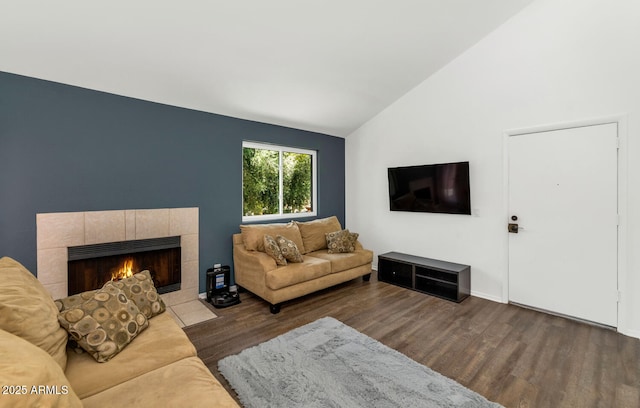 1075 E Chandler Blvd Unit 210, Chandler, AZ 85225 - living room with vaulted ceiling, wood finished floors, and a tiled fireplace