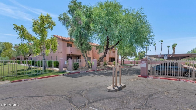 1075 E Chandler Blvd Unit 210, Chandler, AZ 85225 - view of building exterior featuring a fenced front yard