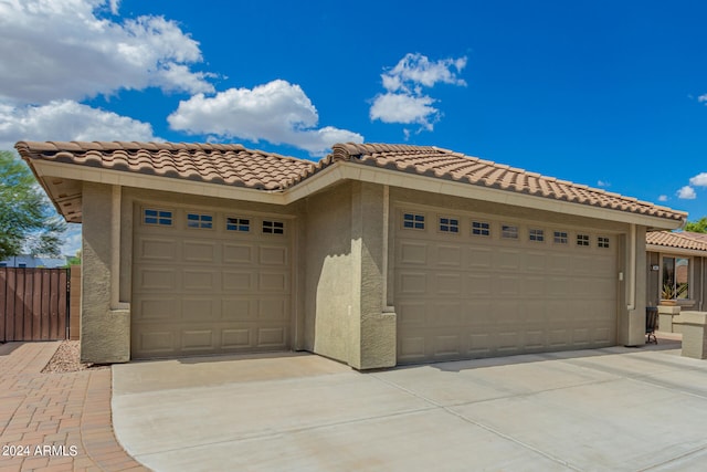 mediterranean / spanish house featuring a garage