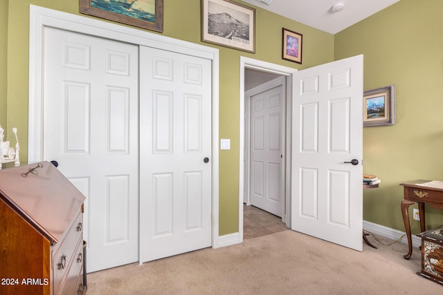 carpeted bedroom with a closet