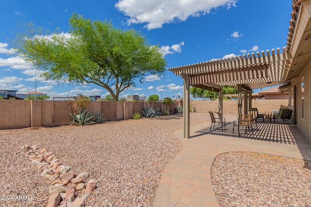 view of yard with a pergola and a patio area