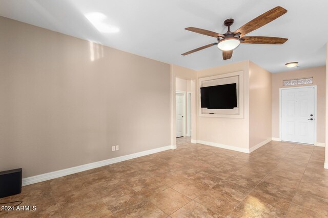 living room with light wood-type flooring and ceiling fan with notable chandelier