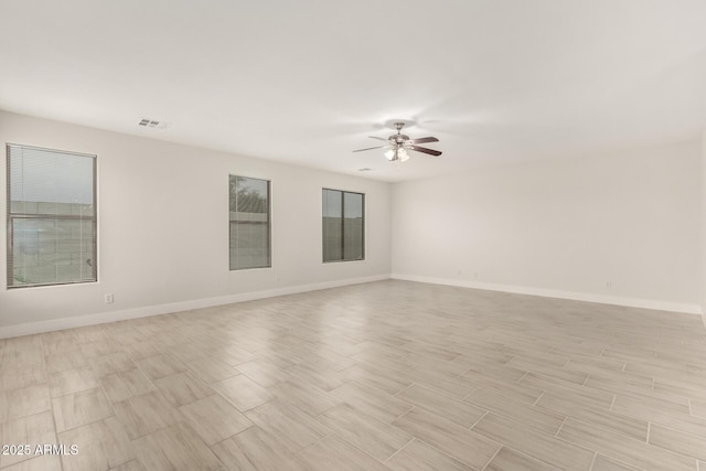 unfurnished room with ceiling fan