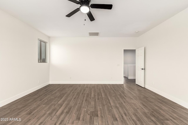 unfurnished room featuring dark wood-type flooring and ceiling fan