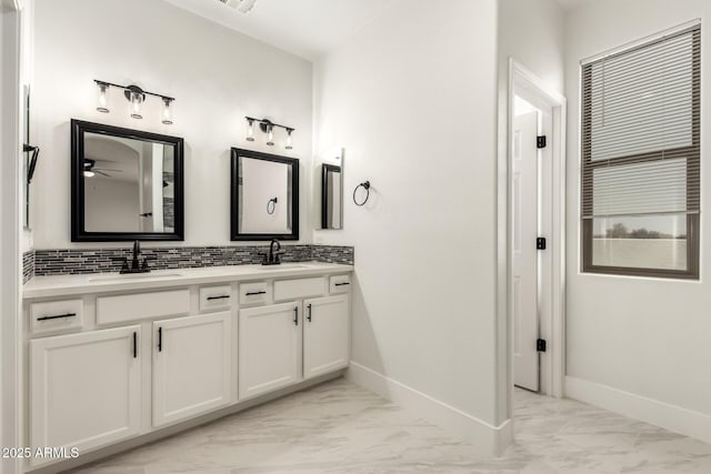 bathroom featuring tasteful backsplash and vanity
