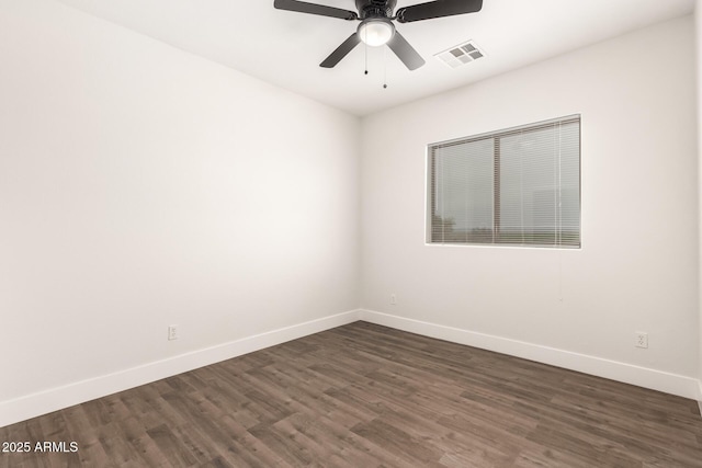 empty room featuring dark hardwood / wood-style floors and ceiling fan