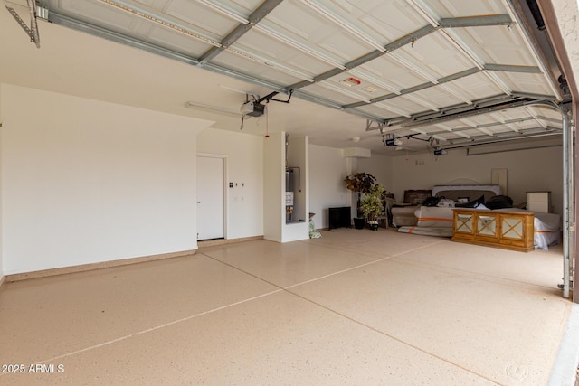 garage with a garage door opener and gas water heater